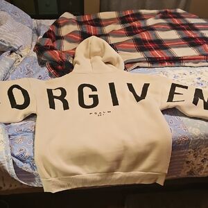 GLO Cream Hoodie with Black Lettering. FORGIVEN written on back